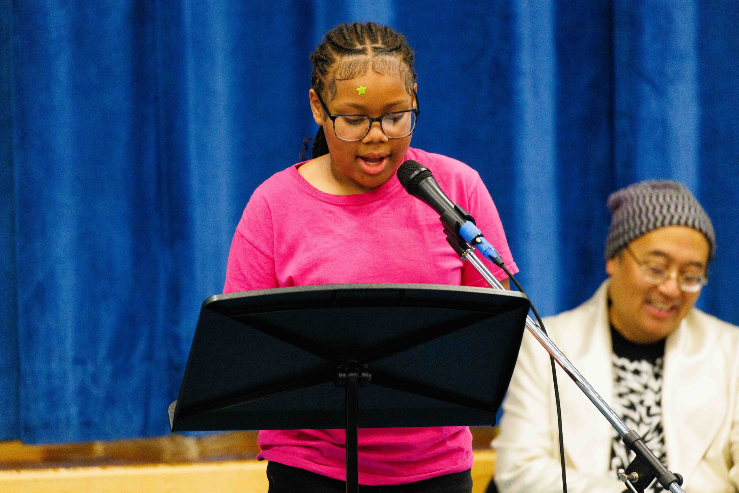 student reciting poetry