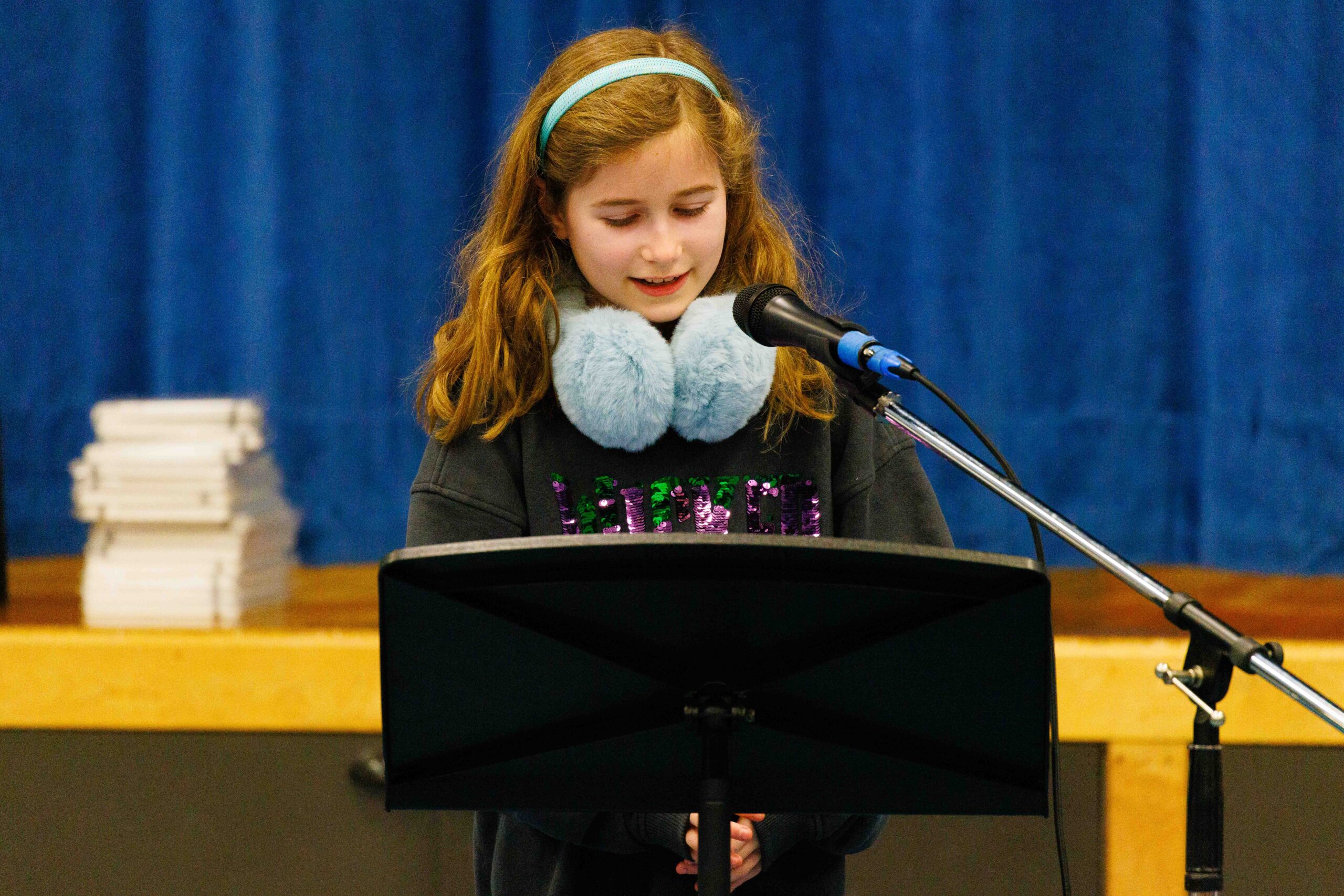 student reciting poetry