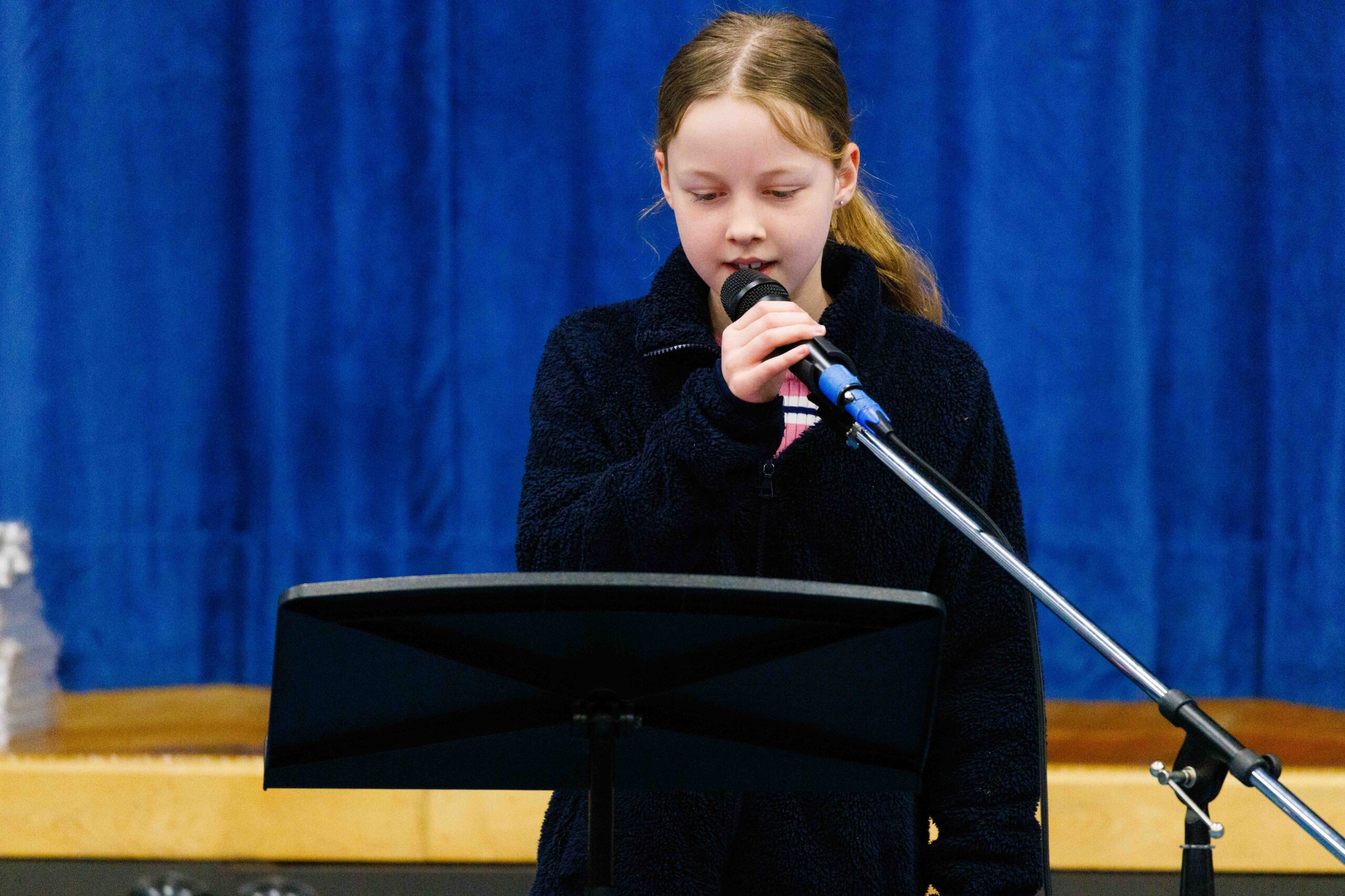 student reciting poetry