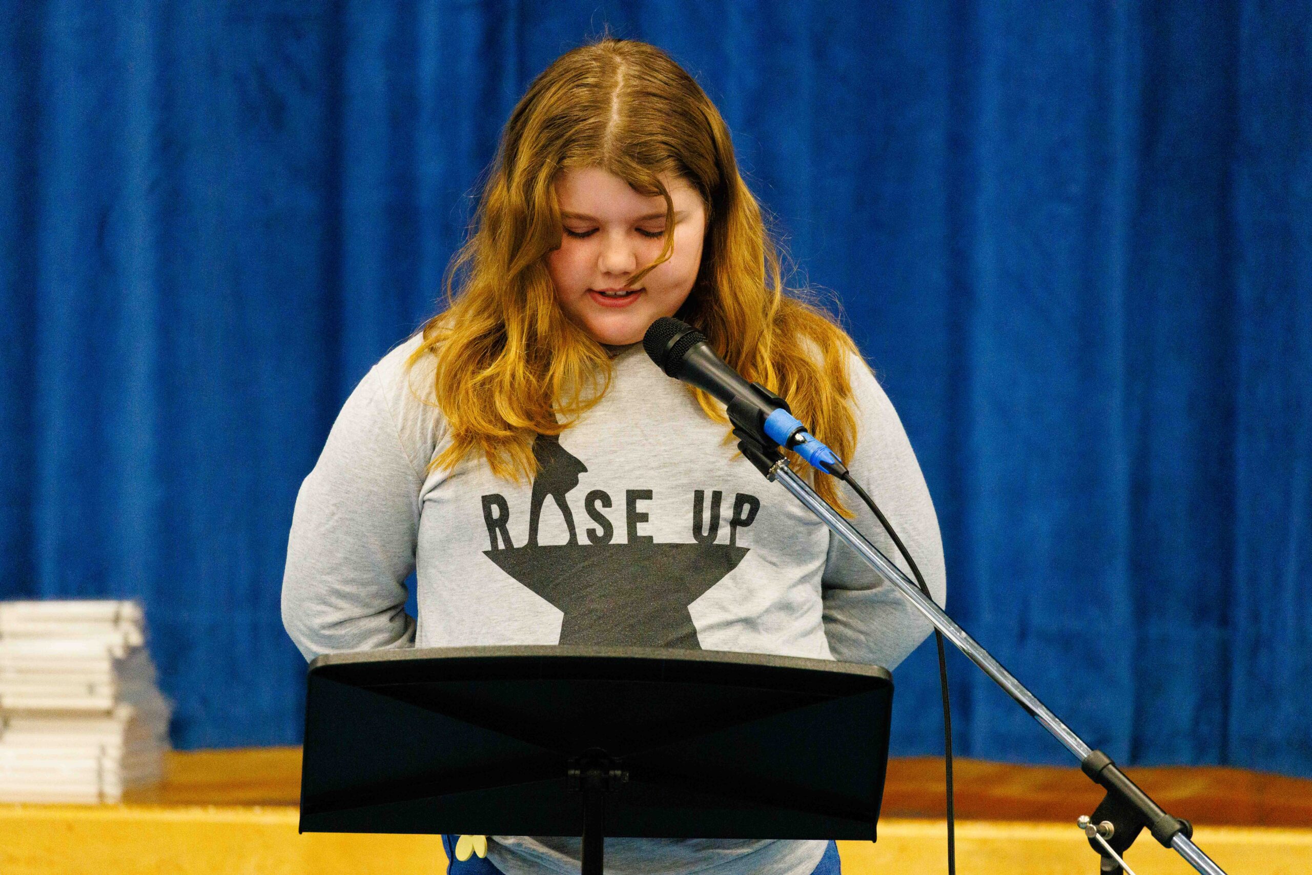 student reciting poetry